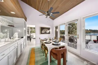 The current owners refreshed the original home with designer tones of refurbished the fabulous built in serving bar with recessed lighting for buffets or sit down sunset dinners.    Easy flow entertaining indoors and out.