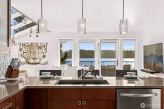 A double drawer dishwasher helps with clean up while the kitchen crew enjoys the view.  The pass through peninsula counter design leaves space for onlookers and kitchen conversations.