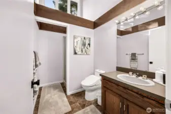 The second upper 3/4 bath serves the occupant of the second bedroom.  Newly installed bidet-style comfort toilet.