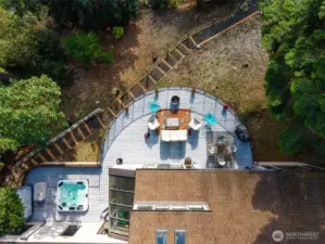 Aerial views of the deck highlight the space and options.  The recently constructed traversing path to the beach stairs features gentle rise steps, hand rails, solar lights and tension wire between treated wood posts.  Amazing.