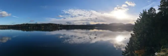 This close-in waterfront property lends easy and quick access to services and a miles from nowhere feel perfect for day to day living, a vacation home or a lucrative vacation rental. West Olympia shopping and medical nearby.