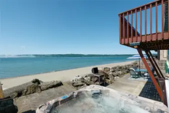 Beach side living! Hot tub right on the beach & enjoy the view, hear the surf & watch the whales. Huge patio area, brand new deck, built in concrete stairs down to the beach, concrete fire pit also built into the bulkhead.