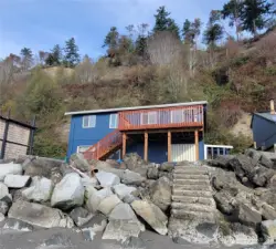 Concrete stairs built into the bulkhead for easy access down to the beach.