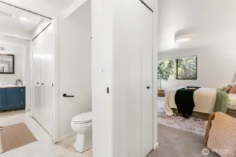 view from primary bedroom to bathroom and utility room