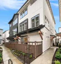 Private side patio space perfect for relaxing or outdoor dining.