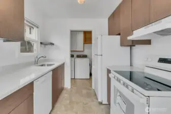 Kitchen view towards laundry. (virtually removed blue plastic from dishwasher)