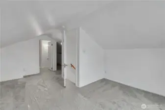 Upstairs primary bedroom with large closet and bathroom.