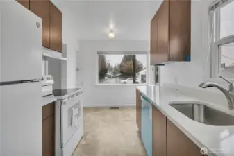 Kitchen with protective plastic cover on the brand new dishwasher.