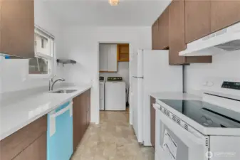 Kitchen with protective cover on the new dishwasher.