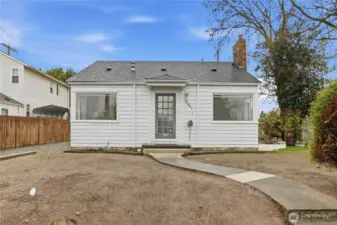 Front of home and cement walkway to the home.