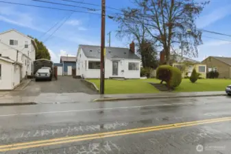 View of home from the street with virtual grass.