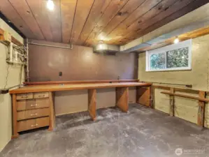 Workshop complete with peg board and work bench.