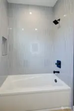 Second bath is located between the 2nd & 3rd bedrooms. Beautifull tile shower walls.