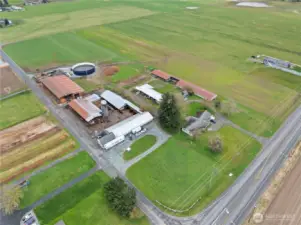 Aerial view of this established 20 acre dairy farm w/ 3 homes & a milk processing plant