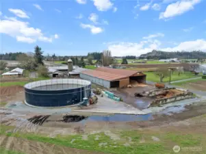 View of the farm from the North. Multiple barns & a Slurrystore manure storage