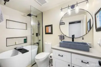 Renovated 'shower room' full bath with all new fixtures and cabinetry! Sleek!