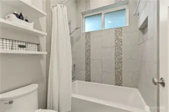 Full Bath with Designer Tile.
