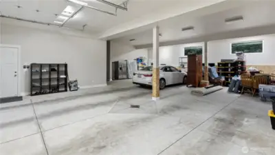 This is just one side of the garages. Also a HALF Bath not shown. Other side has the Built in Storage and room for Covered RV, Boat, Trailer or more Cars!! Or Just a HUGE SHOP!!