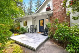 Beautiful stone front porch is perfect for sitting and enjoying the beauty of the property!