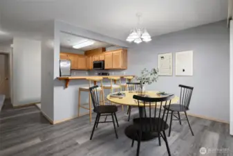 New LVP flooring installed through the living room, dining area and hallways.  Dining area is virtually staged.