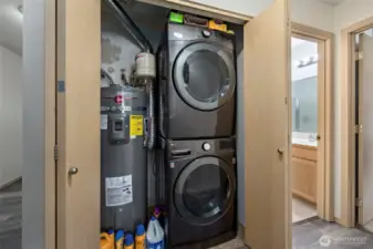 Laundry closet with brand new water heater.