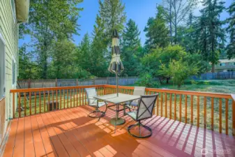 Relax on your composite deck overlooking large backyard
