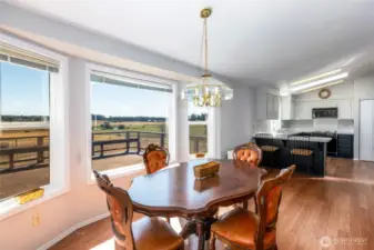 Dining and kitchen area. Kitchen with a breakfast bar, lots of storage and pantry.