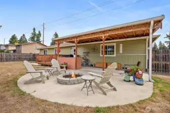 Built-in firepit and custom concrete patio.