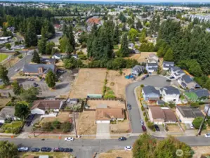Huge corner lot with endess potential to make your own!