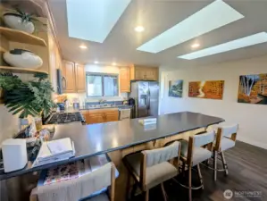 Skylights enhance the kitchen brightness.