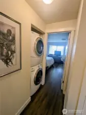 Stackable washer and dryer in the hallway stay with the condo.