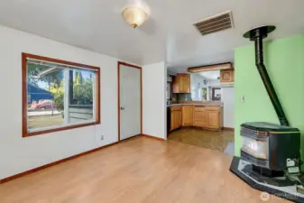 Living room leading into the walkthrough kitchen.