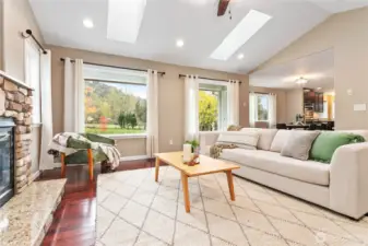 Skylights and enlarged living room windows bring in extra light and Sumas Mountain beyond.