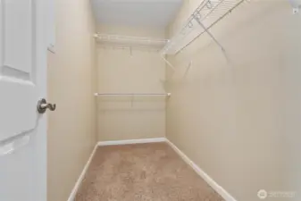 Walk-in primary bedroom closet
