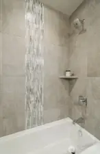 Tiled tub area in upper bath.