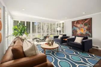 It's hard to overstate the scale of this spectacular room.  The chairs and sofa are large pieces, well-spaced, with ample room for a chaise to boot.