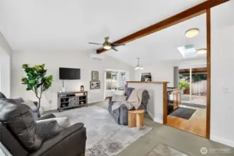 Light filled open concept living area w/ charming bay window