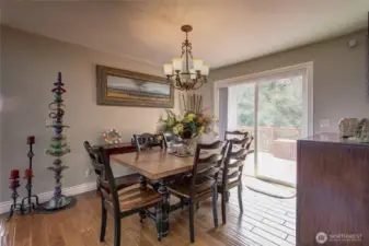Opposite the great room is the dining room, with a slider out to a large rear deck, overlooking the back yard.