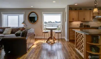 Stepping past the great room and dining room, we enter the kitchen and living room space.