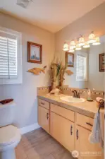 Moving back towards the front entry, the main floor is rounded out by the half bathroom and....