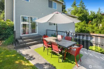 Expansive back yard w/ outdoor kitchen, multiple entertaining areas, Swim Spa & garden beds