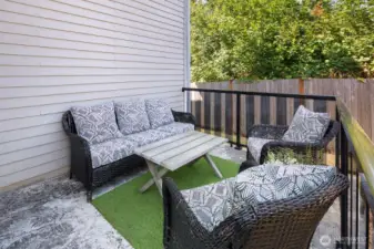 Expansive back yard w/ outdoor kitchen, multiple entertaining areas, Swim Spa & garden beds