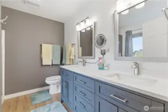 Updated bathroom with a dual-sink vanity for added convenience