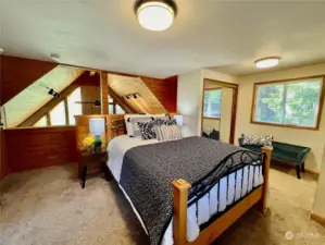 Gorgeous primary loft bedroom w/ tons of closet space including one walk-in closet.
