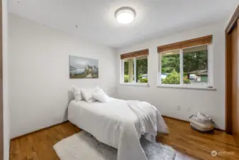 Bedroom One is located on the upper level and has hardwood floors.