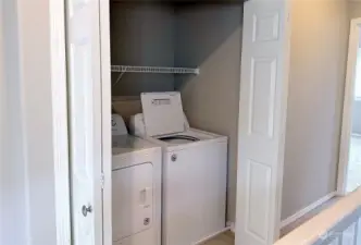 Washer and dryer in hallway upstairs