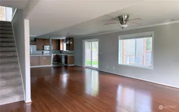 Great room with living room area, dining area and open plan kitchen