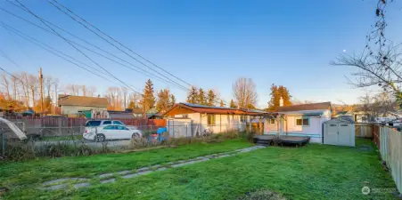 Convenient alley access, ready to add a gate, at the rear of the property, adding functionality and flexibility to the fully fenced yard.