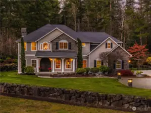 Set near  the Cascade Mountains, this luxurious private home is  nearly 5 acres of lush grounds and lawns that include a  sprinkler system and pitching field range for the golfer.