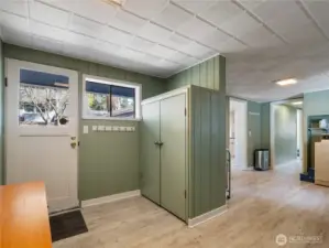 Side door to the attached carport and storage
